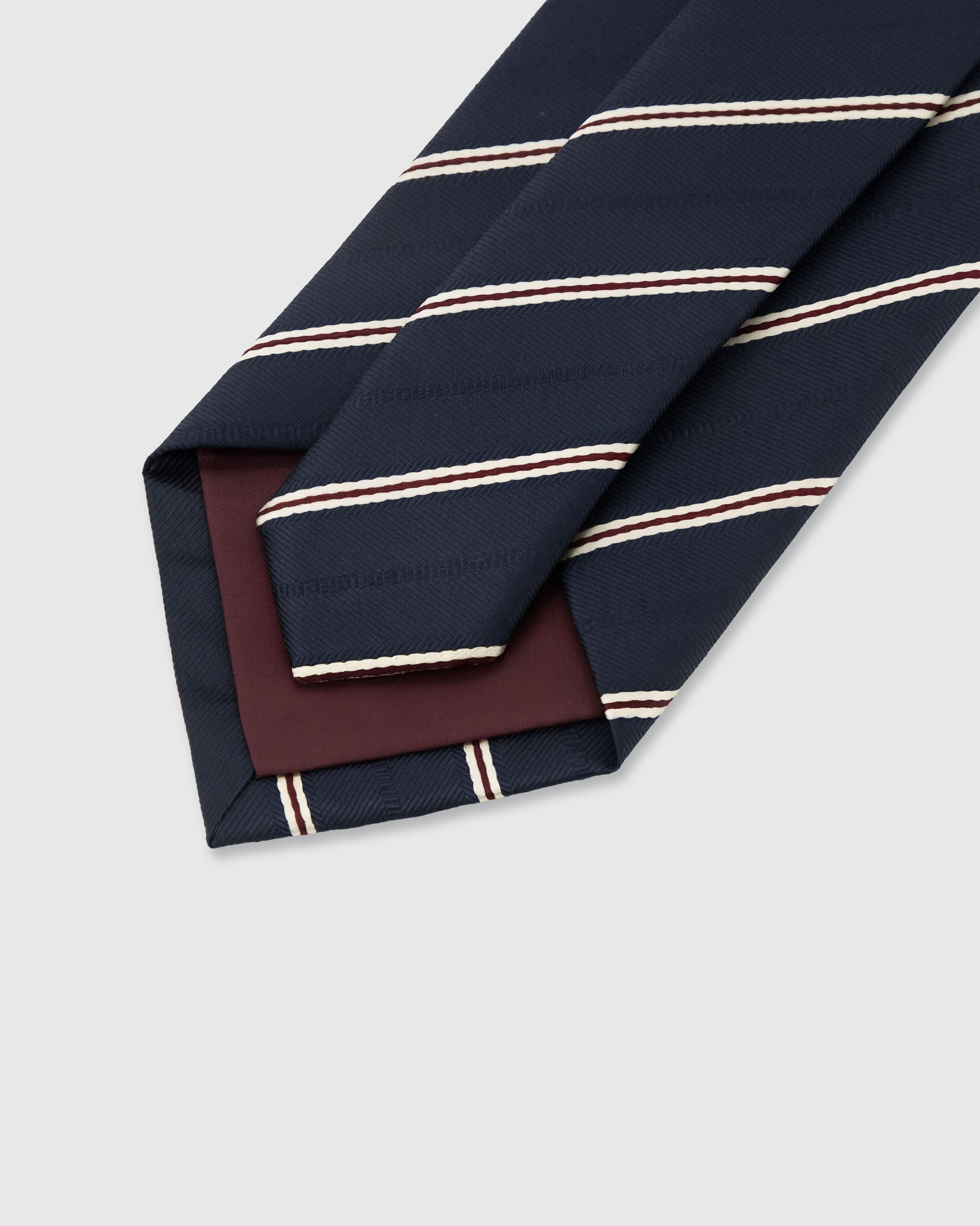 {Hand-finished interior} STICKYZOO MIDNIGHT BOURBON STRIPE TIE back detail showing structured interlining and hand-finished slip stitching, 145 x 8 cm