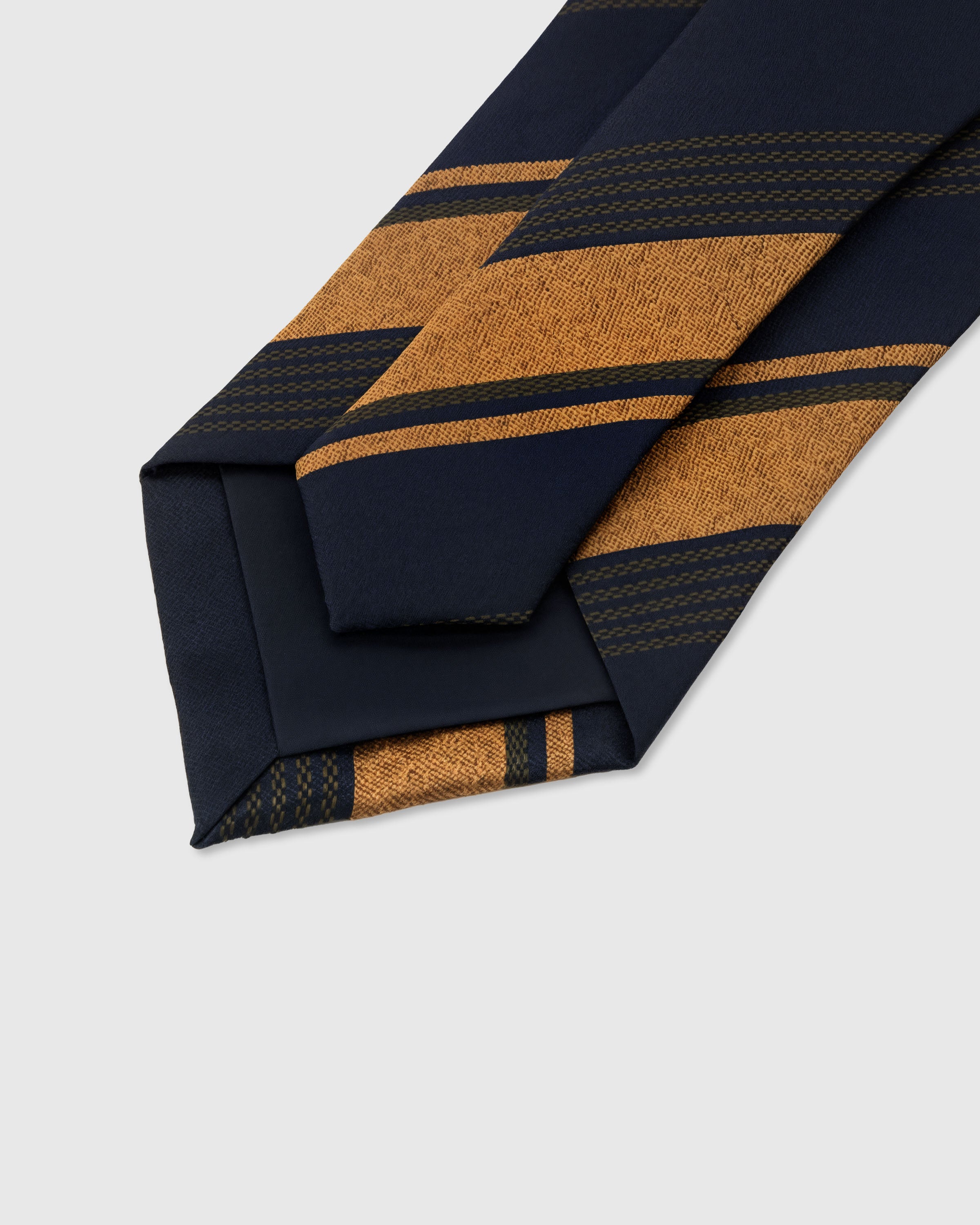 STICKYZOO Amber Club Tie construction detail showing structured interlining and hand-finished slip stitching, 145 x 8 cm
