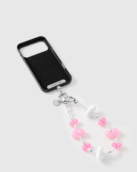 Inside of phone case showing STICKYZOO Phone Strap Card with cloud heart strap attached