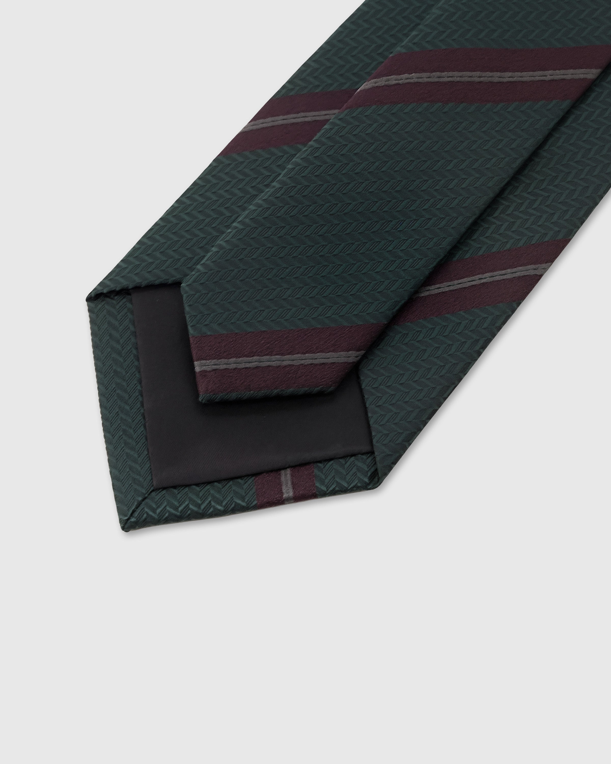 STICKYZOO Evergreen Stripe Tie interior showing hand-finished slip stitching and structured interlining, 145 × 8 cm