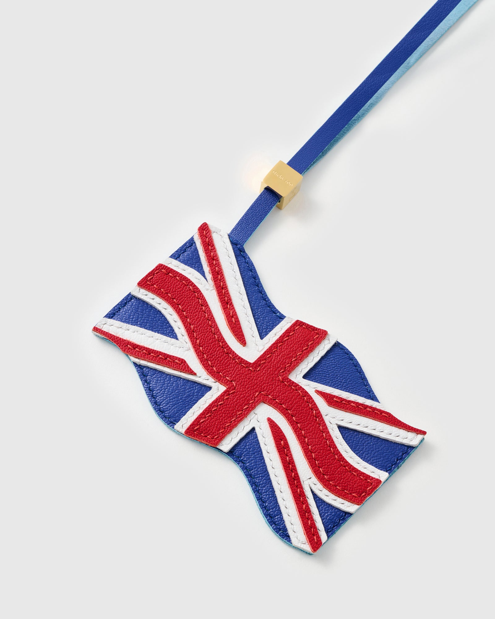 Union Jack charm on black structured handbag — handmade waving British flag by STICKYZOO