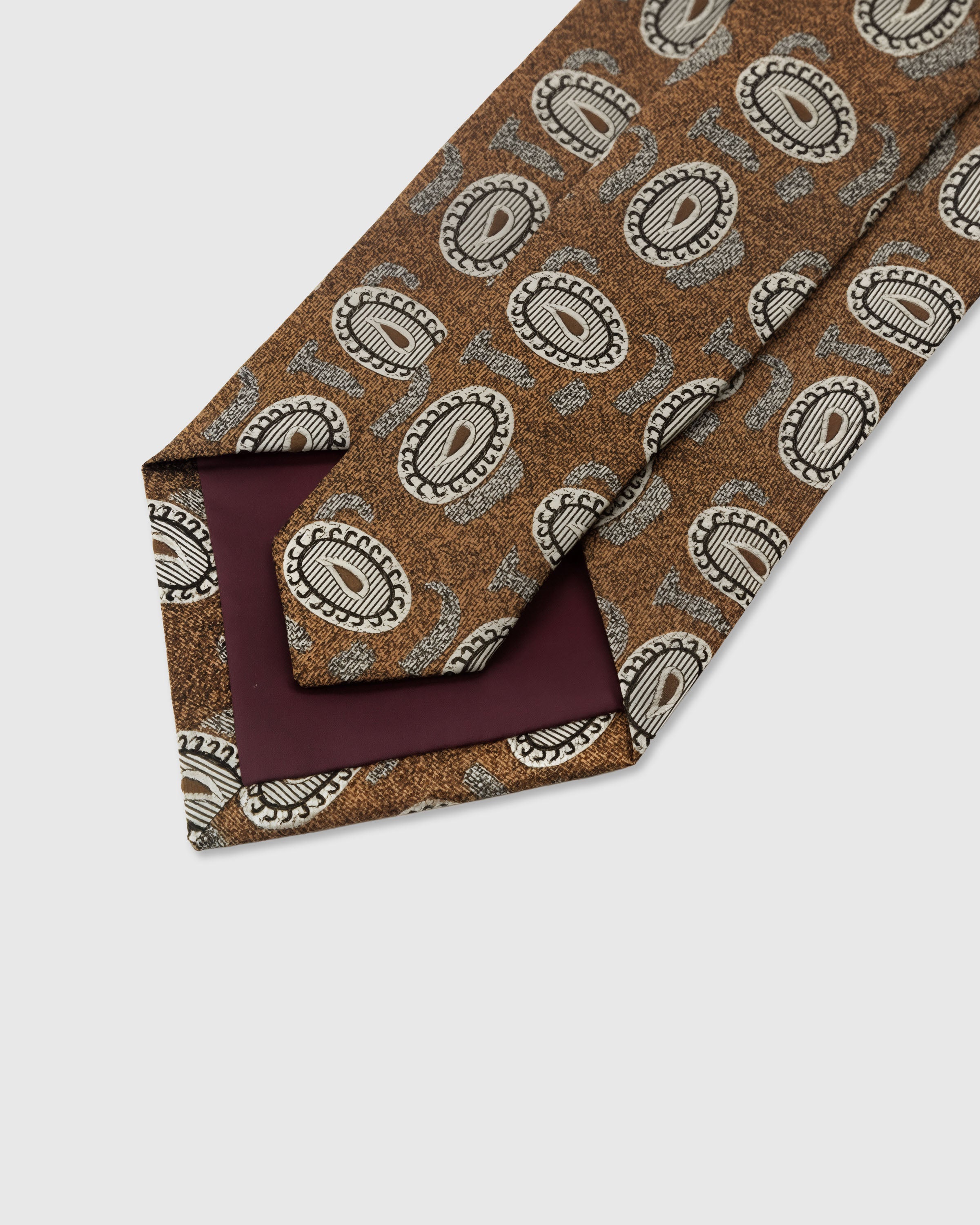 STICKYZOO Tawny Paisley Tie back detail showing structured interlining and hand-finished slip stitching, 145 x 8 cm