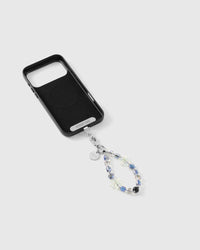 Iridescent aurora starfish strap clipped to a black phone case, beads shifting blue to clear with silver-tone spacers between them