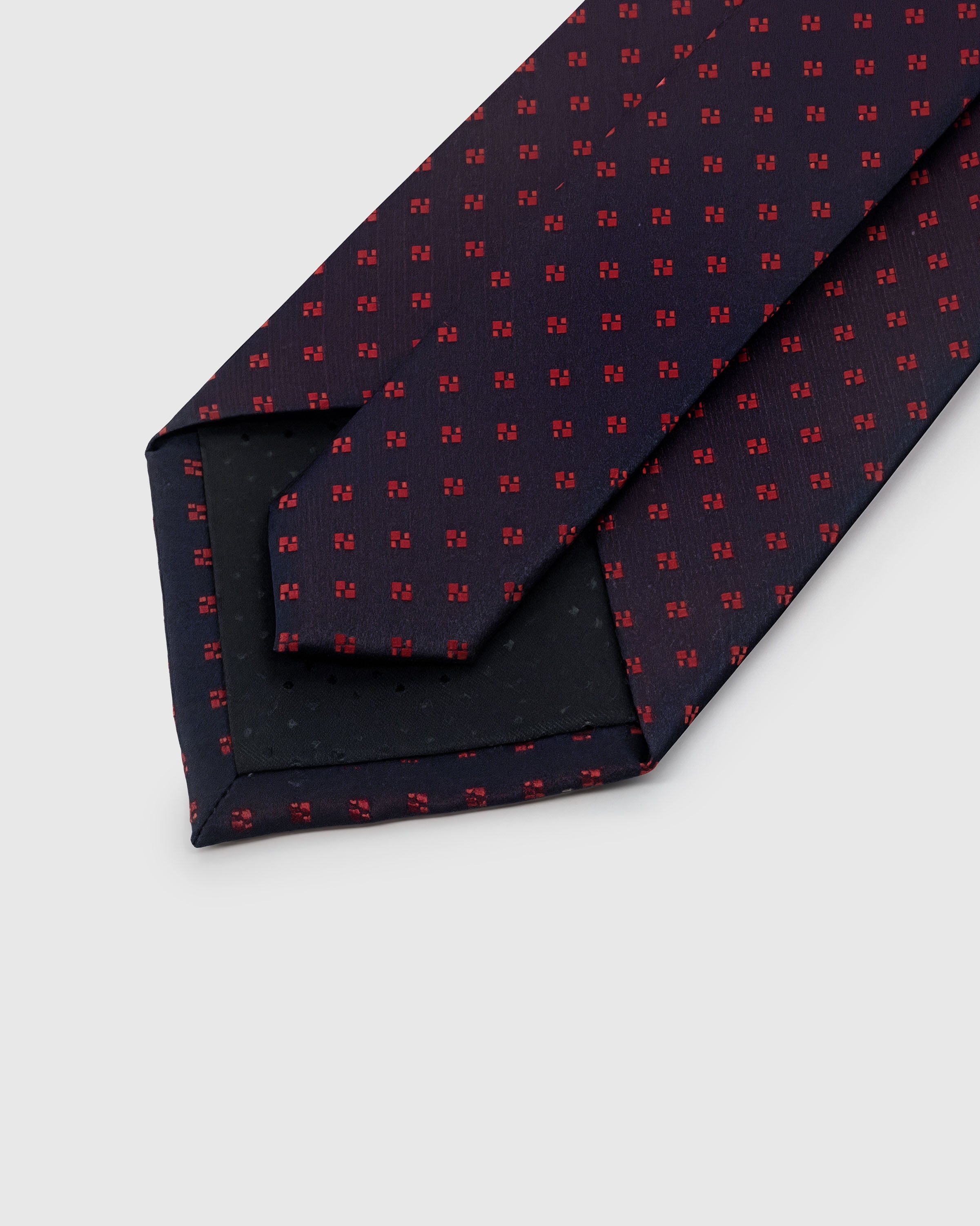STICKYZOO Midnight Micro Tie back detail showing black interlining and hand-finished slip stitching, 145 × 8 cm
