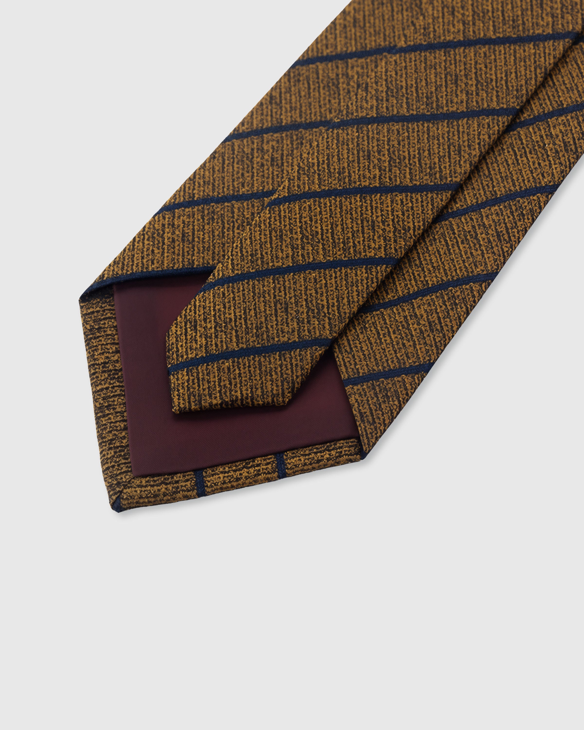 {Hand-finished interior} STICKYZOO TOFFEE NAVY STRIPE TIE back detail showing structured interlining and hand-finished slip stitching, 145 x 8 cm