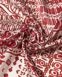 STICKYZOO crimson folklore silk scarf coiled to show the hand-illustrated print and magenta accents on cream