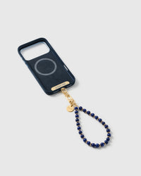 Cobalt-blue stone bead strap attached to a phone case with the included Phone Strap Card