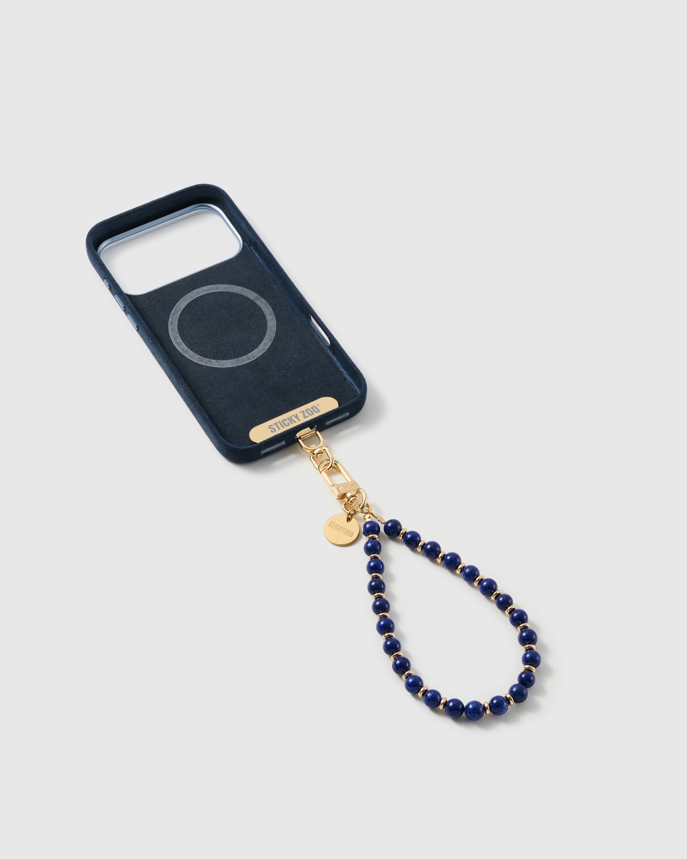 Cobalt-blue stone bead strap attached to a phone case with the included Phone Strap Card