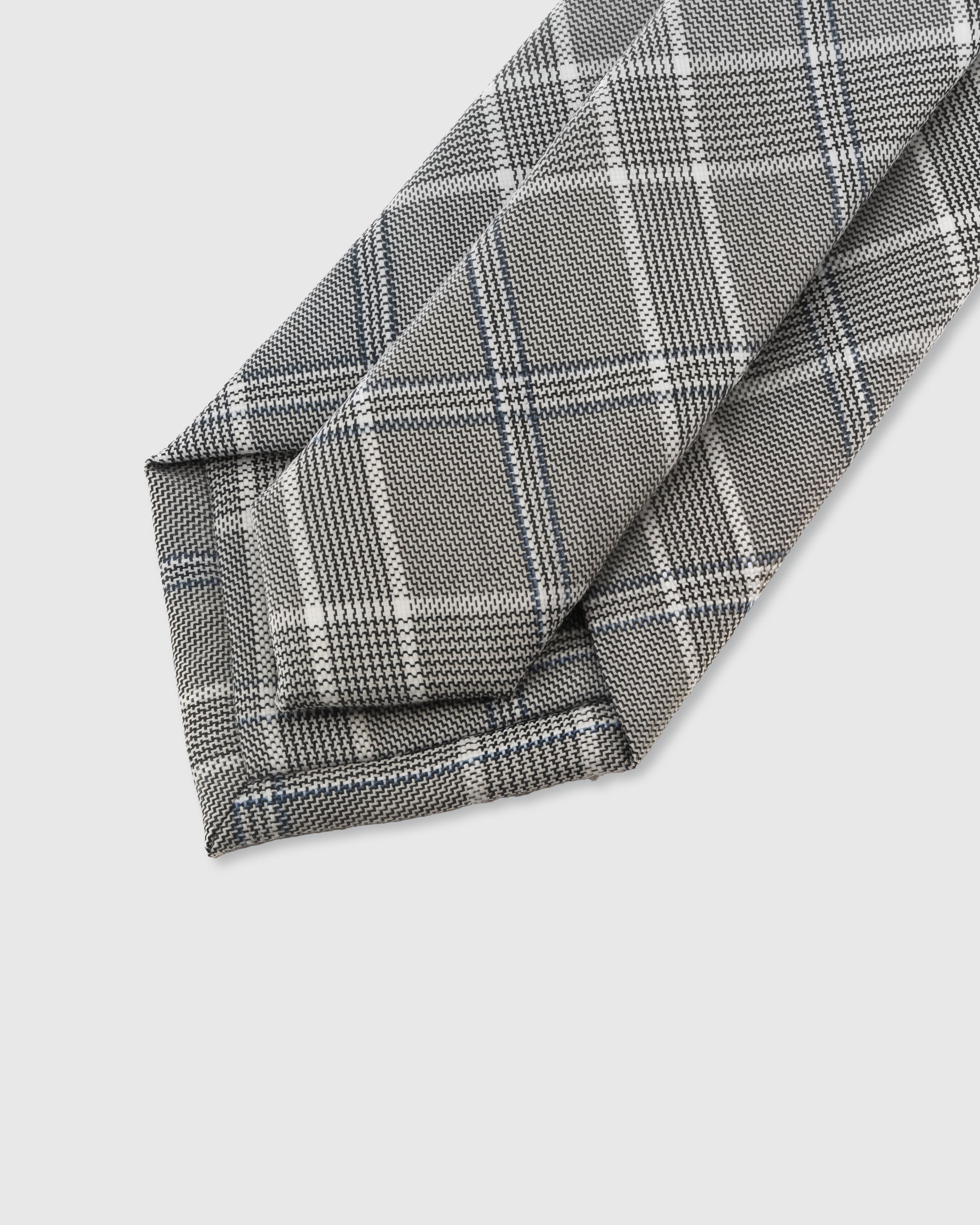 {Hand-finished interior} STICKYZOO STERLING GLEN CHECK TIE back detail showing structured interlining and hand-finished slip stitching, 145 x 8 cm