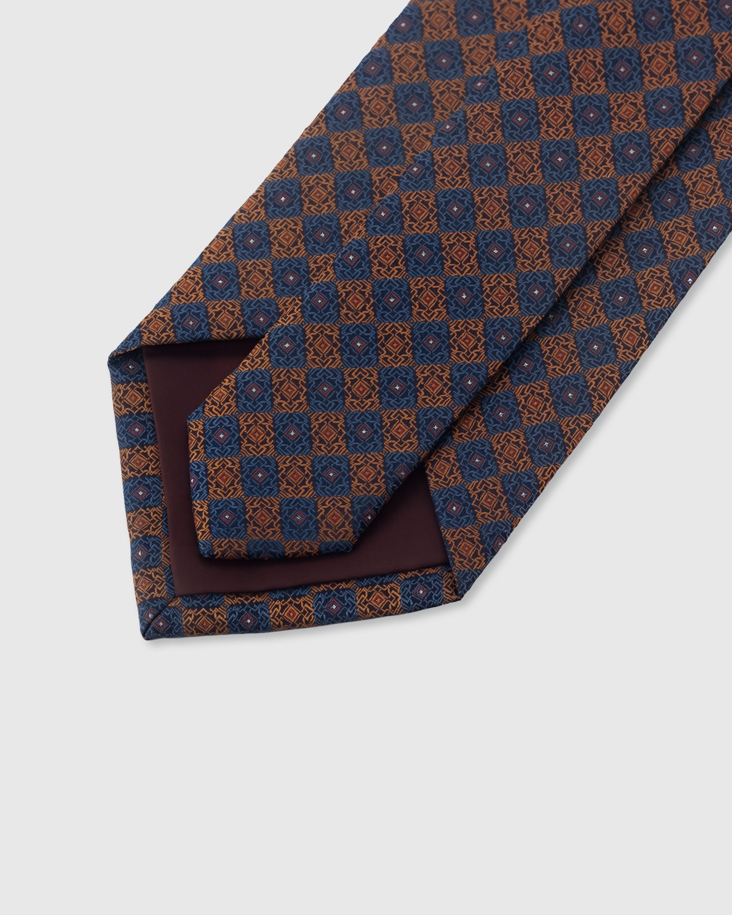 {Hand-finished interior} STICKYZOO MIDNIGHT COPPER MOSAIC TIE back detail showing structured interlining and hand-finished slip stitching, 145 x 8 cm