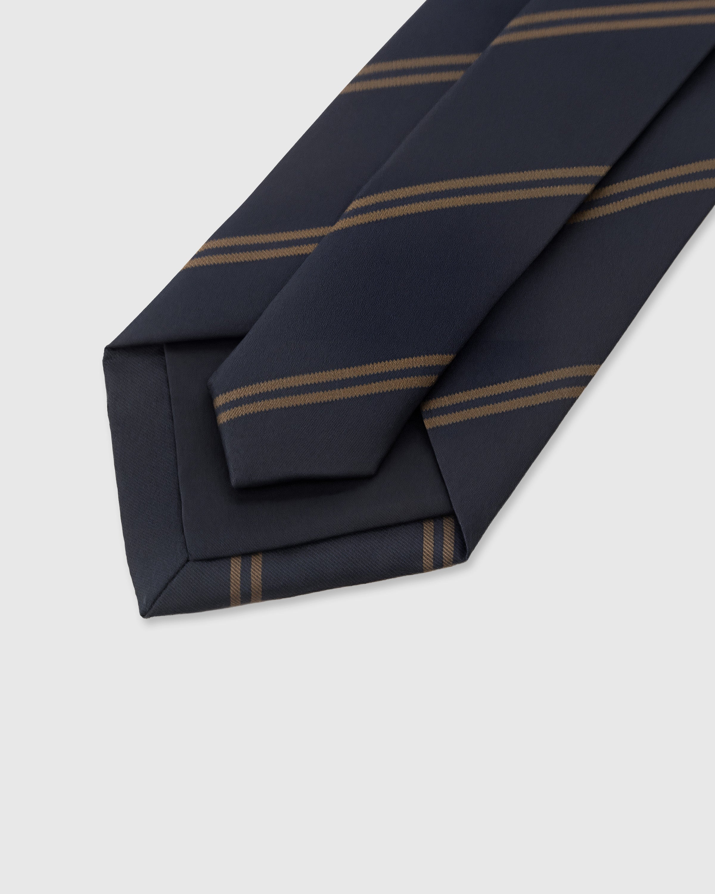 STICKYZOO Midnight Bronze Stripe Tie back detail showing structured interlining and hand-finished slip stitching, 145 x 8 cm