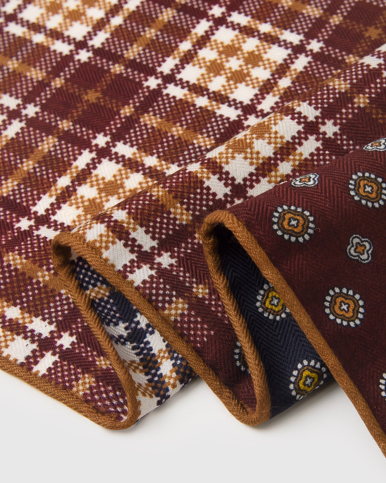 Close-up of the hand-illustrated houndstooth check and foulard medallion quadrants printed on pure silk
