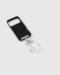 Beaded wrist strap on the back of a black MagSafe phone case, white pearl-effect beads, silver foil heart and iridescent cloud bead
