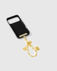 Inside of phone case showing STICKYZOO Phone Strap Card with golden pearl strap attached