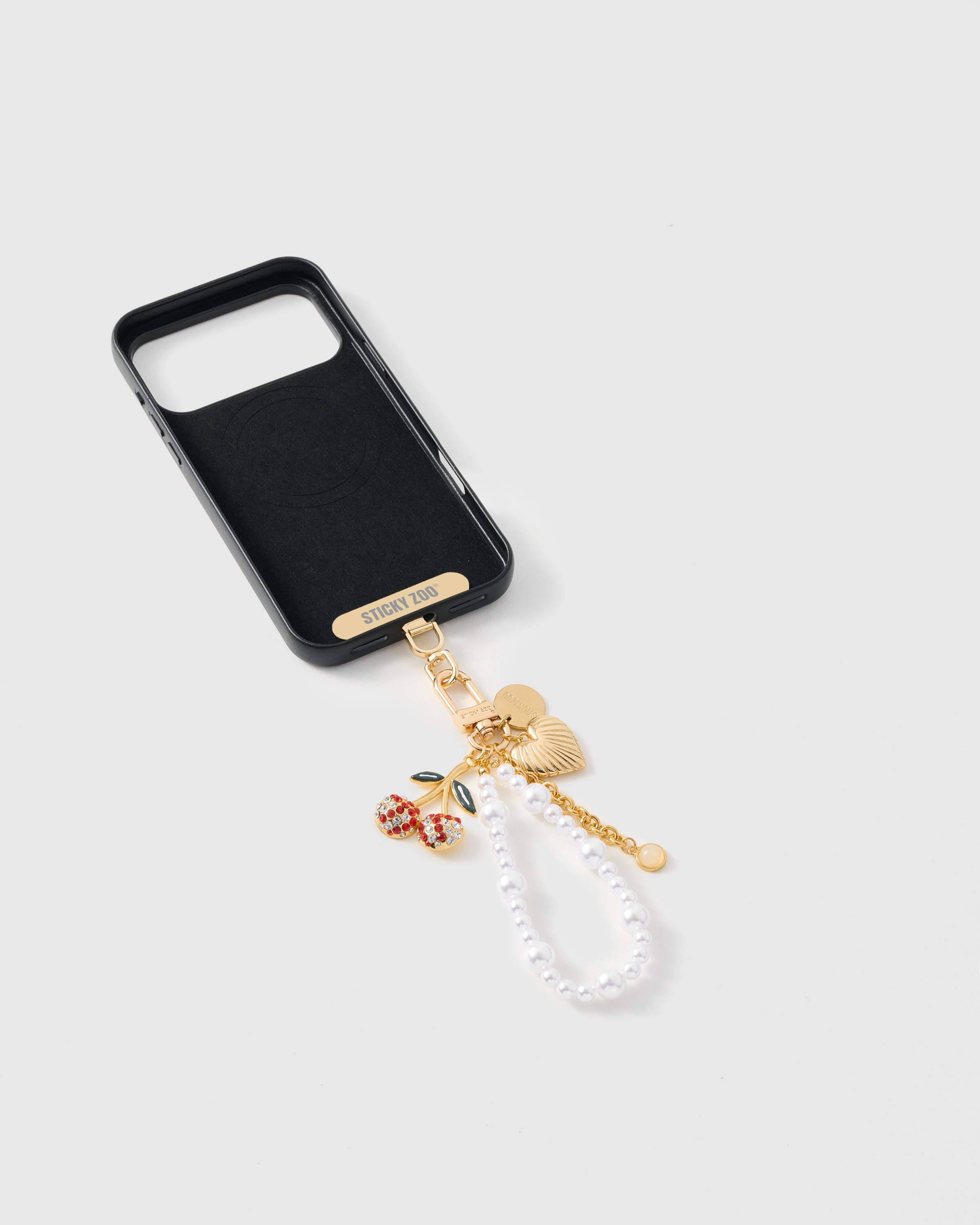 {{Strap Card included}} Inside of phone case showing STICKYZOO Phone Strap Card with pearl orbit strap attached