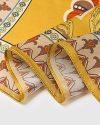 Close-up of the hand-illustrated medallion border printed in archival inks on pure silk