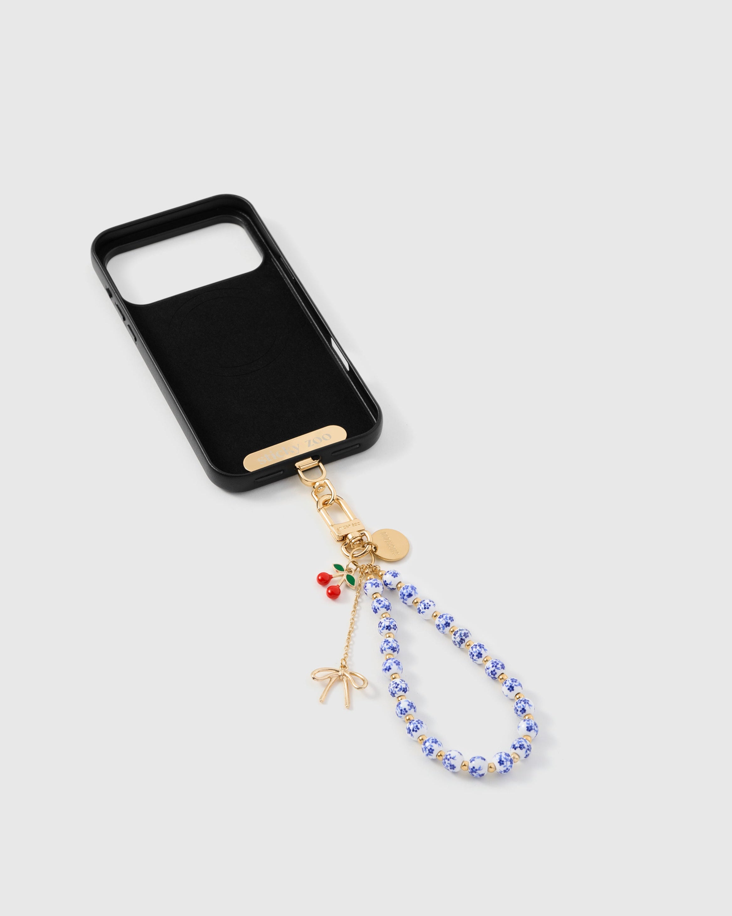 iPhoneアクセサリー winsome._4 Porcelain Cherry Phone Strap — Handmade Floral Bead Wristlet