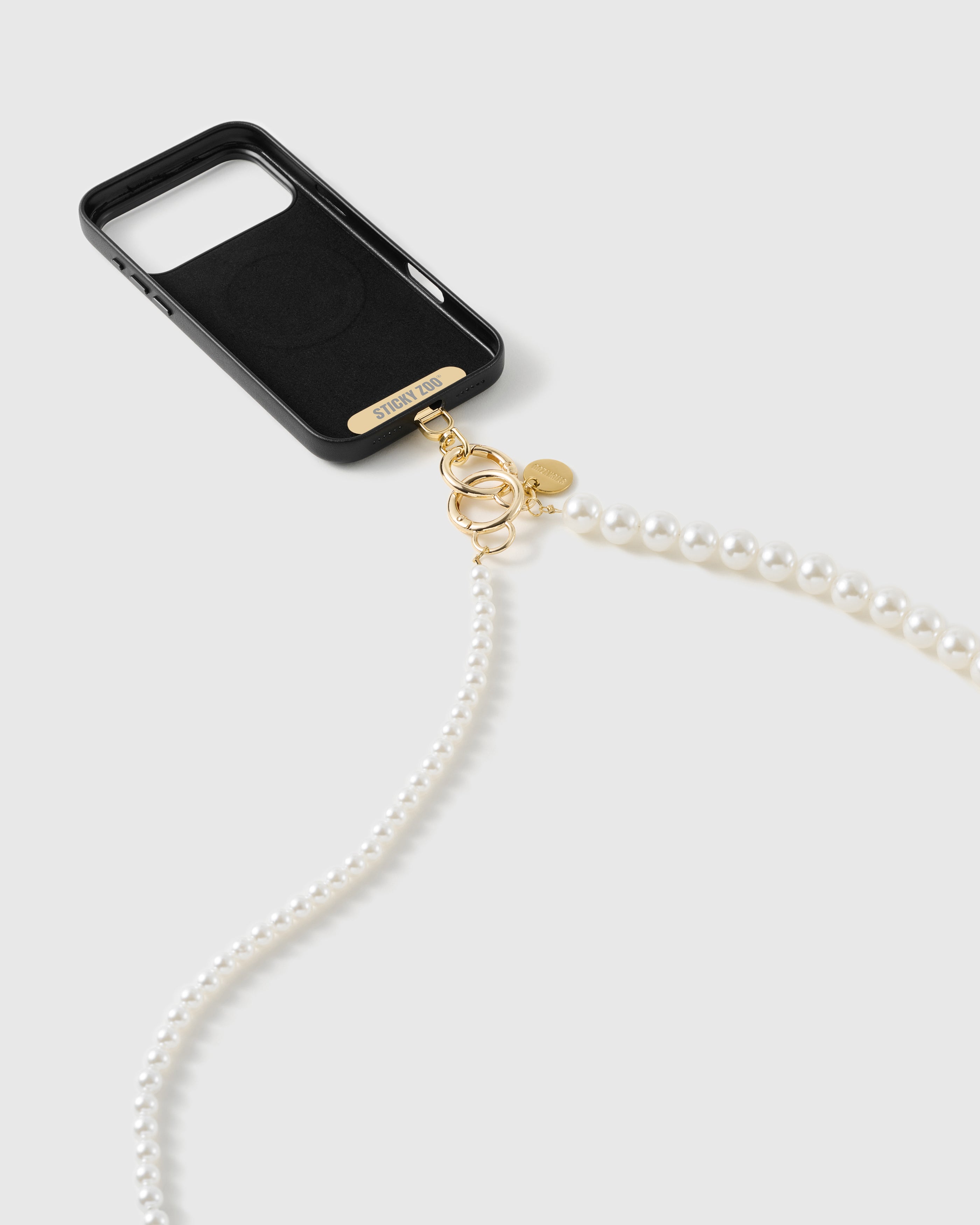 STICKYZOO gold-tone plate and dual clasps on a black case, small faux-pearls leading into larger ones down the strap