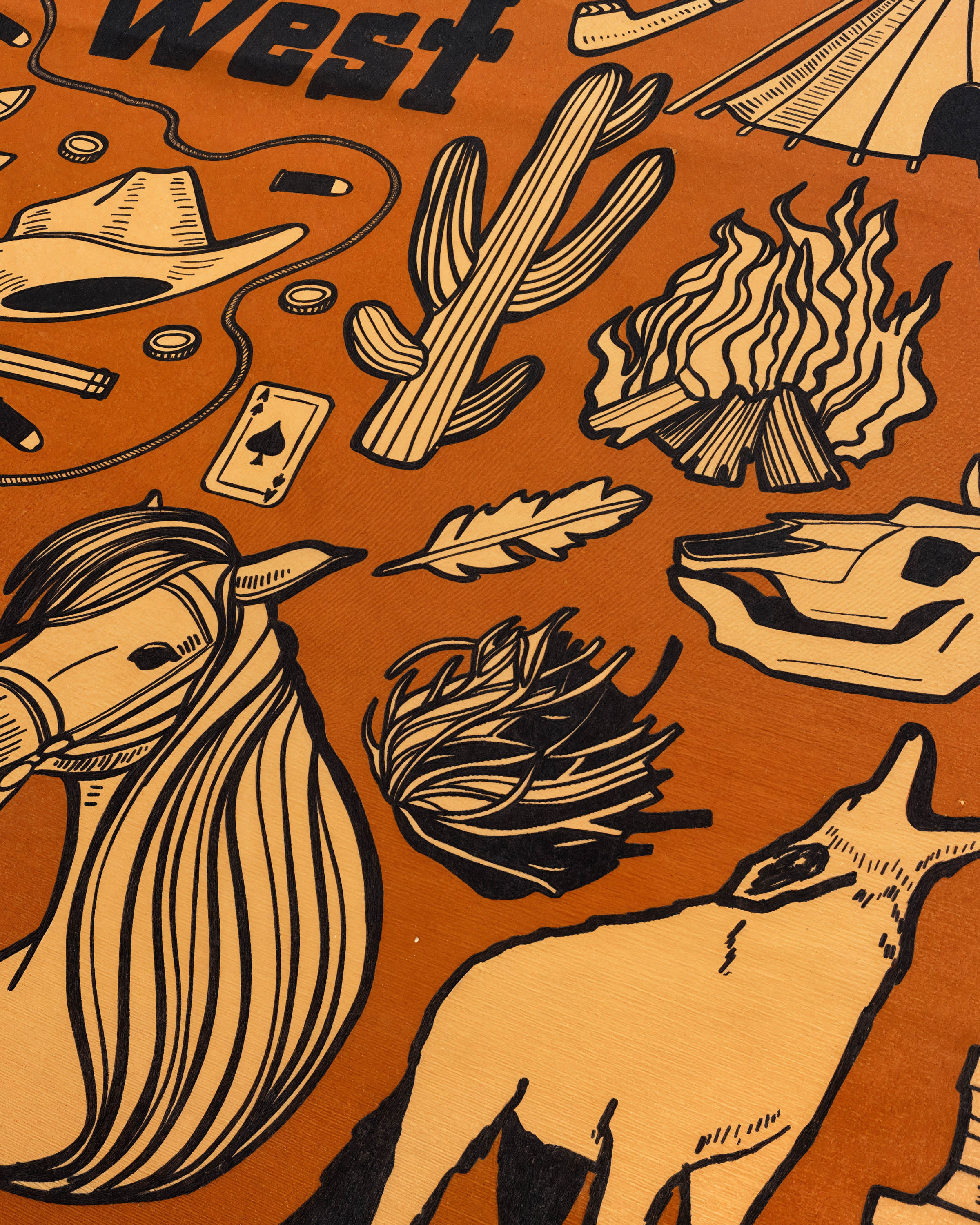 Close-up of the hand-illustrated campfire and longhorn skull printed in archival inks on pure silk