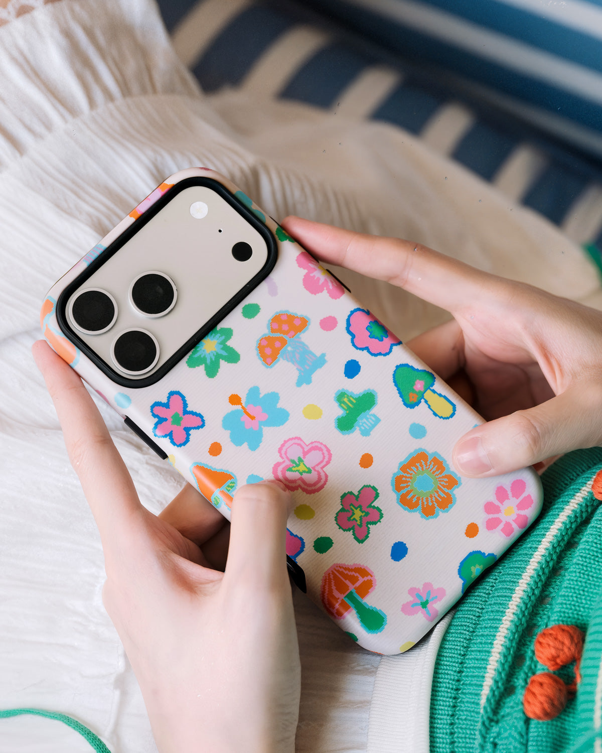 Back of the pixel mushroom phone case showing 8-bit florals and mushrooms on UV-printed cream ABS