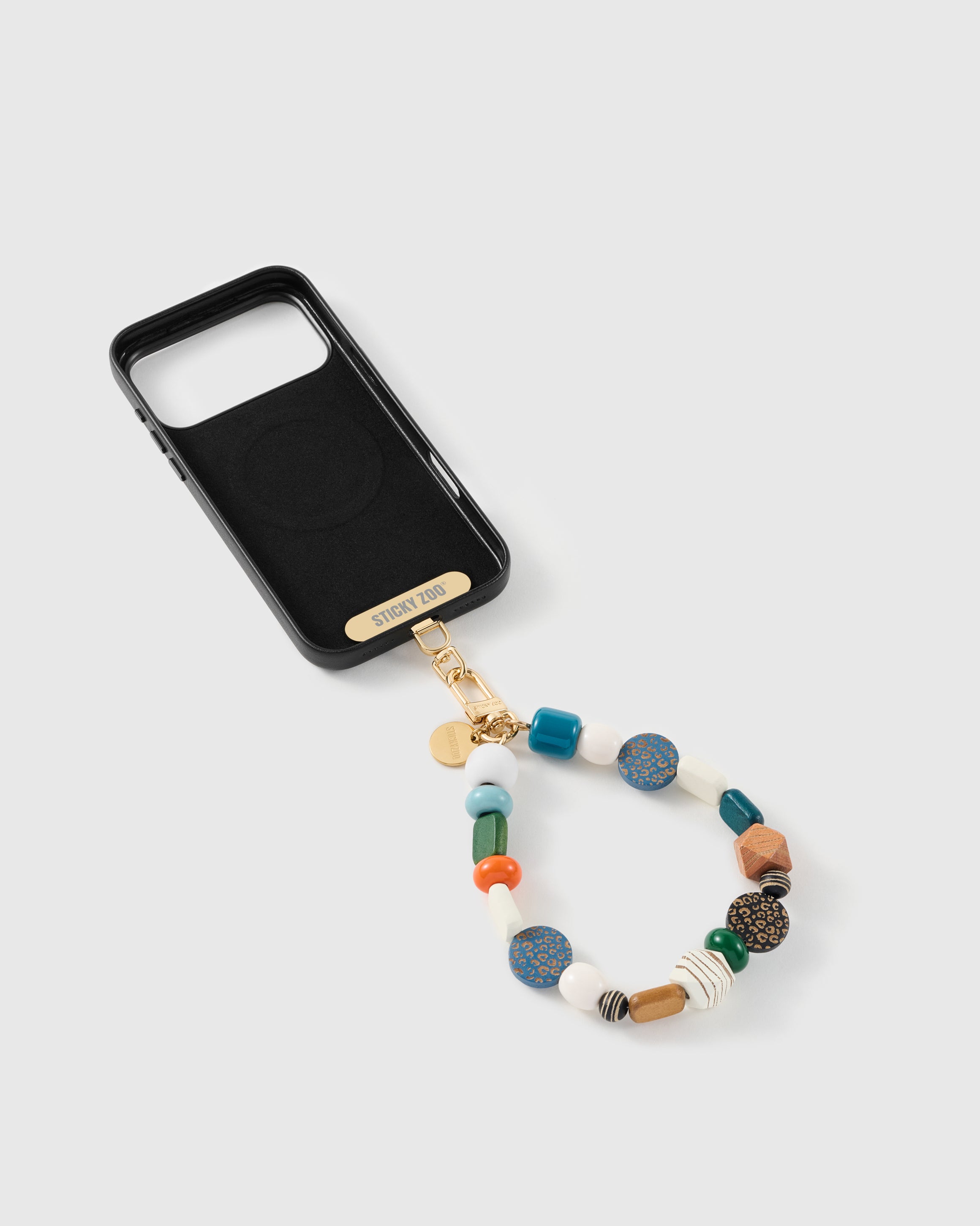 Safari mixed bead strap attached to a phone case with the included Phone Strap Card