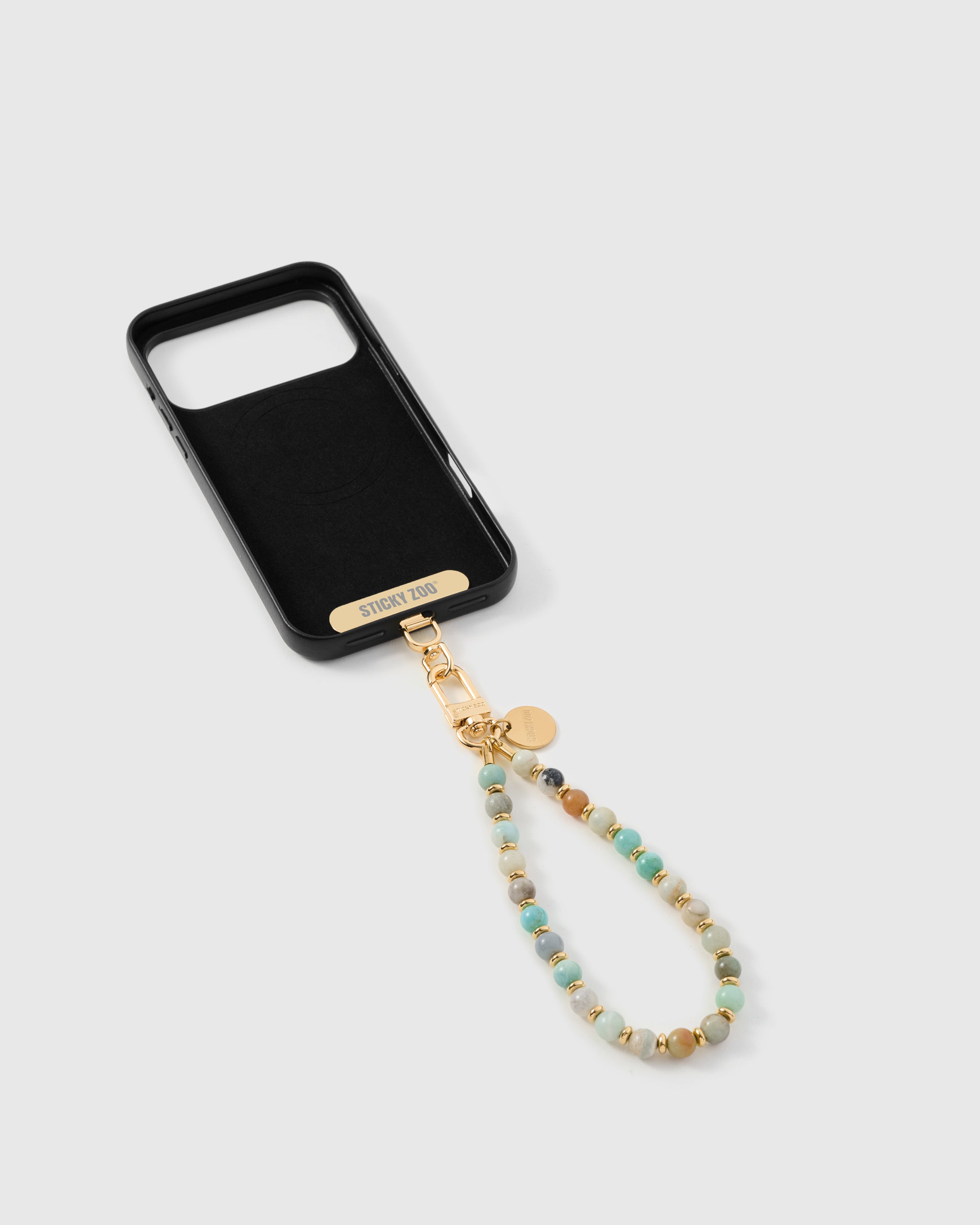 {{Strap Card included}} Inside of phone case showing STICKYZOO Phone Strap Card attachment slot
