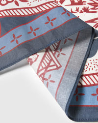 Close-up of the slate-blue rope-knot border meeting the cream silk field