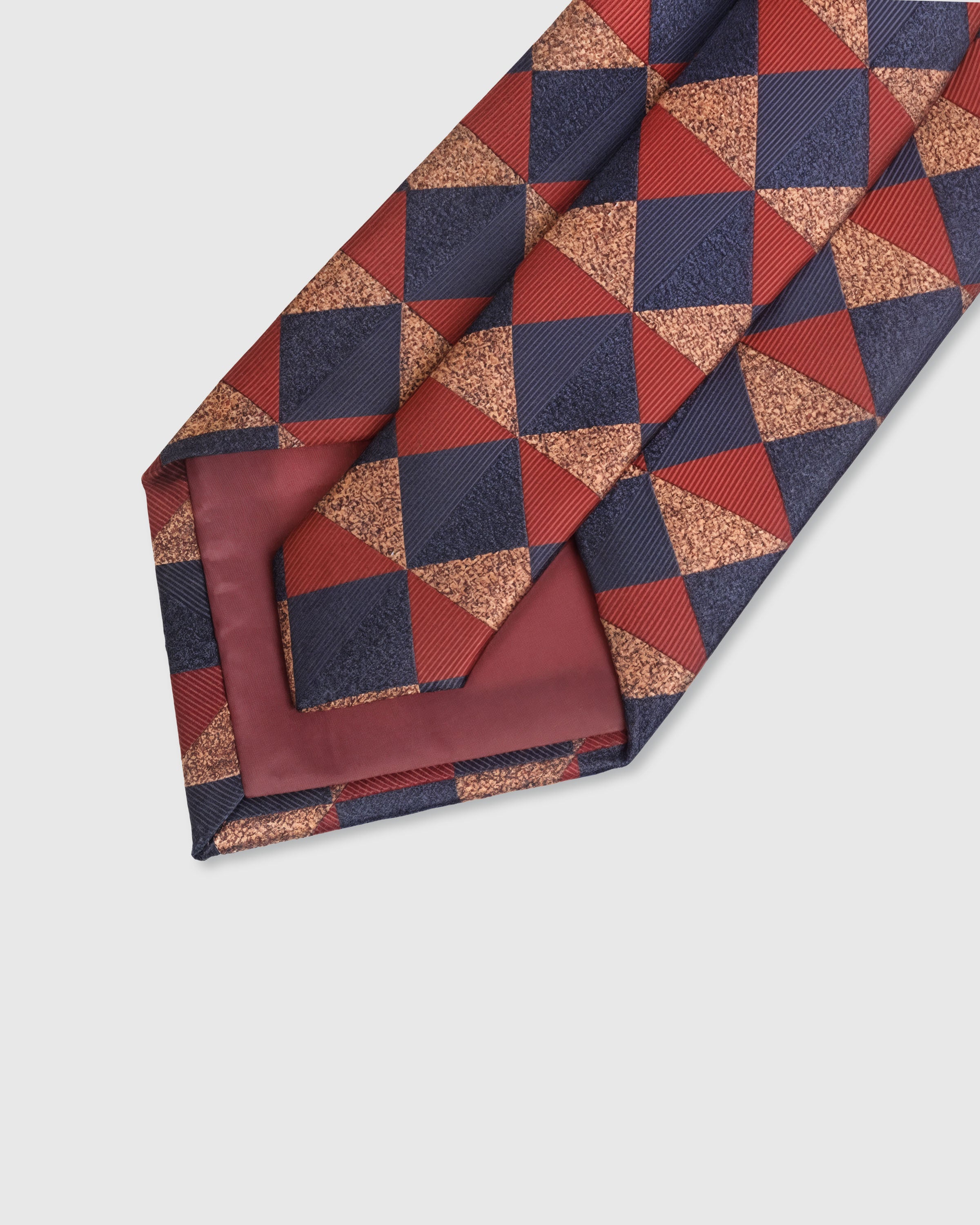 {Hand-finished interior} STICKYZOO EMBER HARLEQUIN TIE back detail showing structured interlining and hand-finished slip stitching, 145 x 8 cm