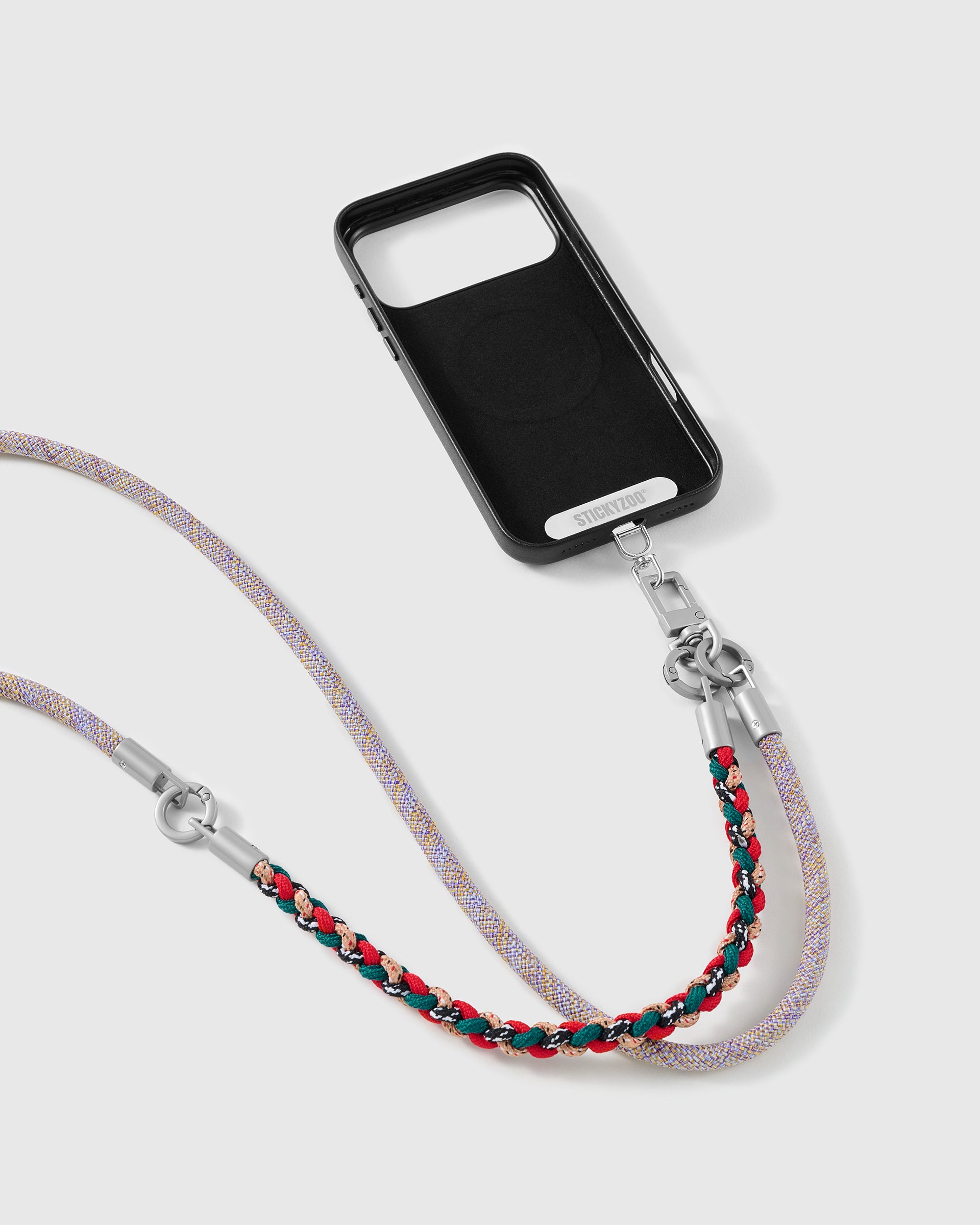 Heather strap clipped to a black phone case for hands-free carry