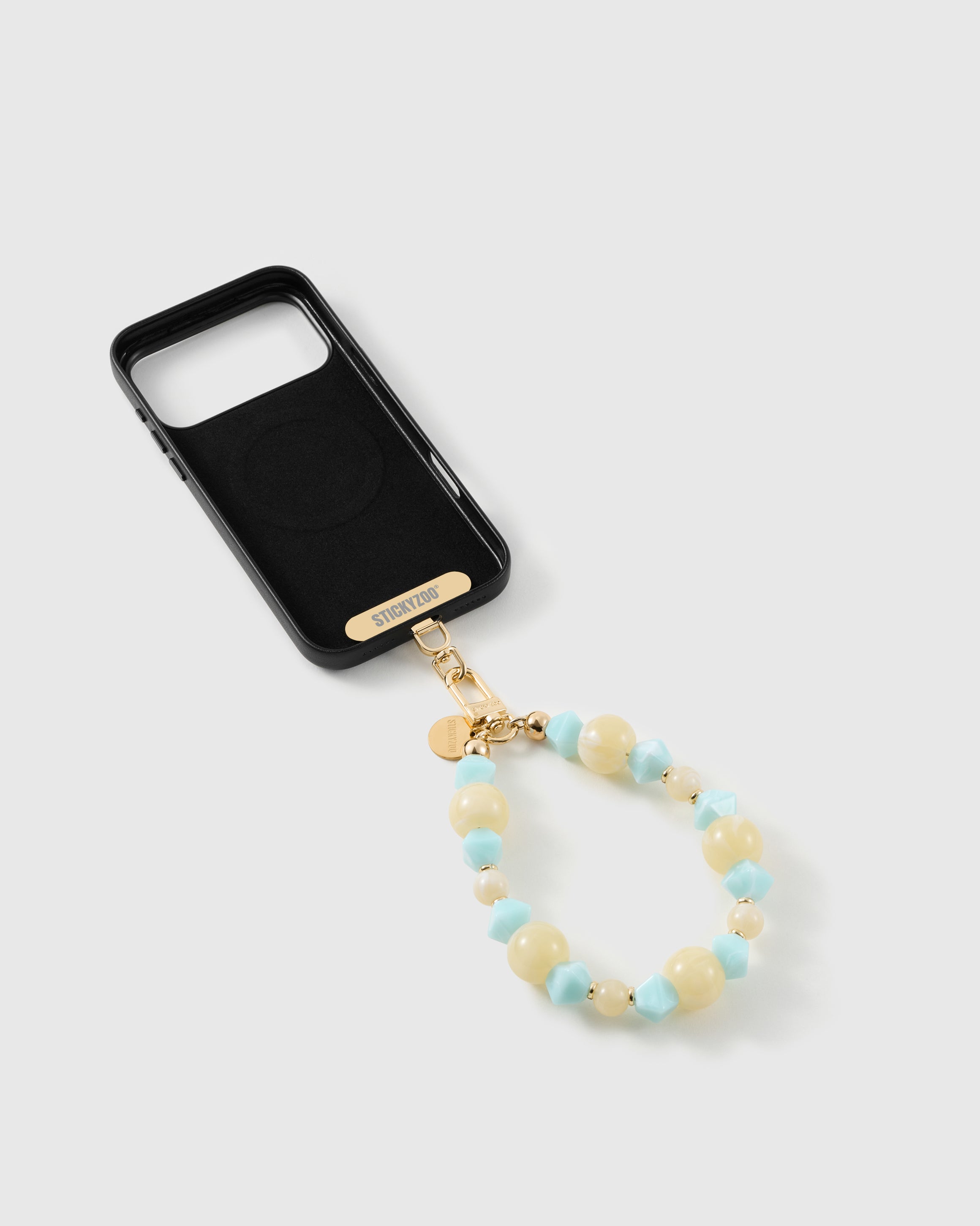 Aqua bead strap attached to a phone case with the included Phone Strap Card