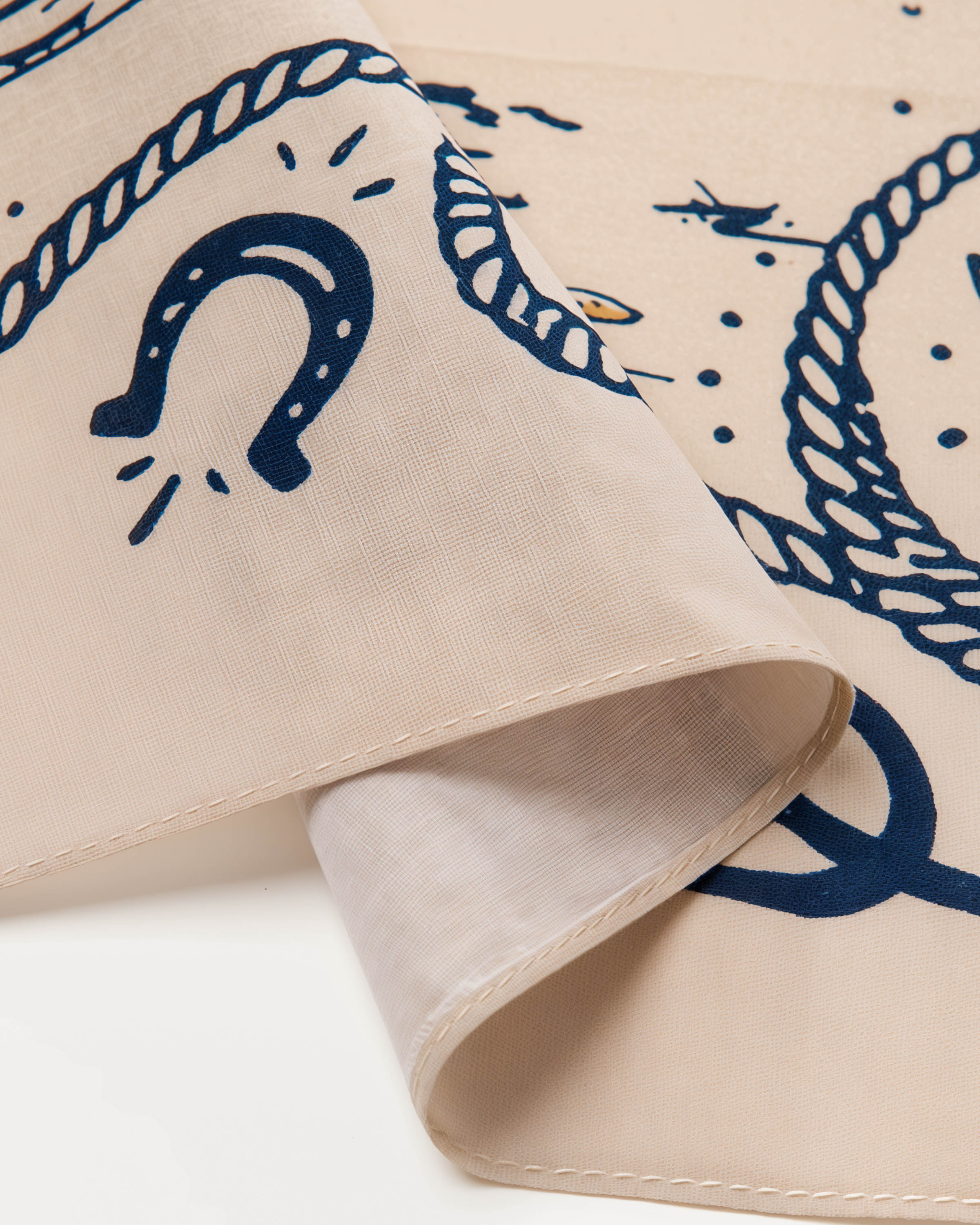 STICKYZOO desert outlaw silk scarf showing the horseshoe corner detail printed in archival navy ink