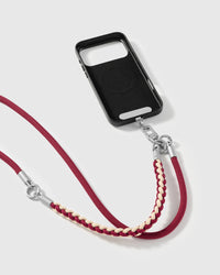 Burgundy cross-body phone strap clipped to a phone case for hands-free carry