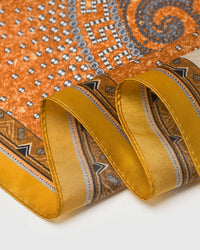 STICKYZOO gallop patchwork silk scarf with paisley medallion, rust horses on ivory, and saffron frame
```