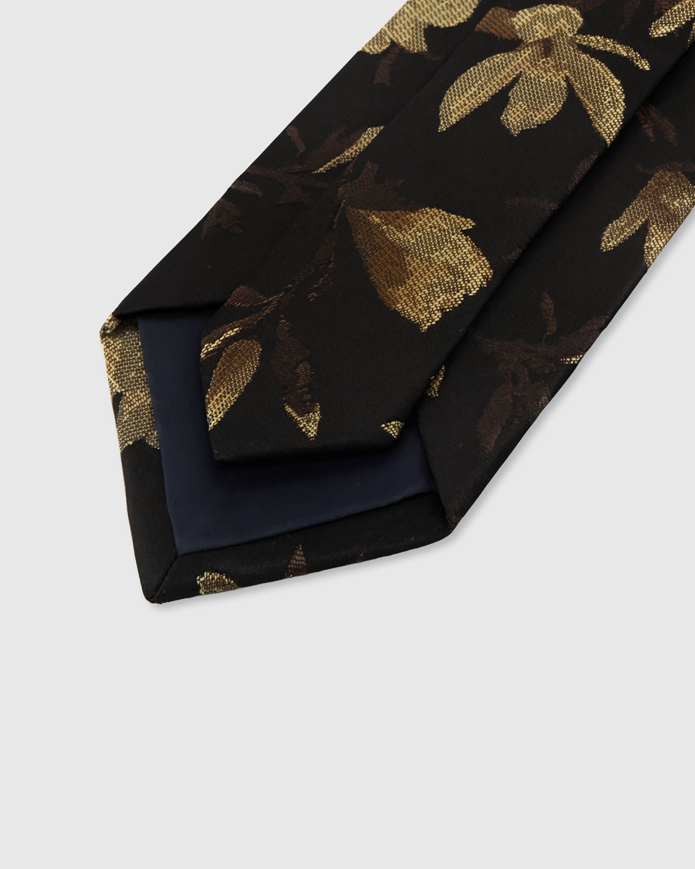 {Hand-finished interior} STICKYZOO NOIR GILDED BLOOM TIE back detail showing structured interlining and hand-finished slip stitching, 145 x 8 cm
