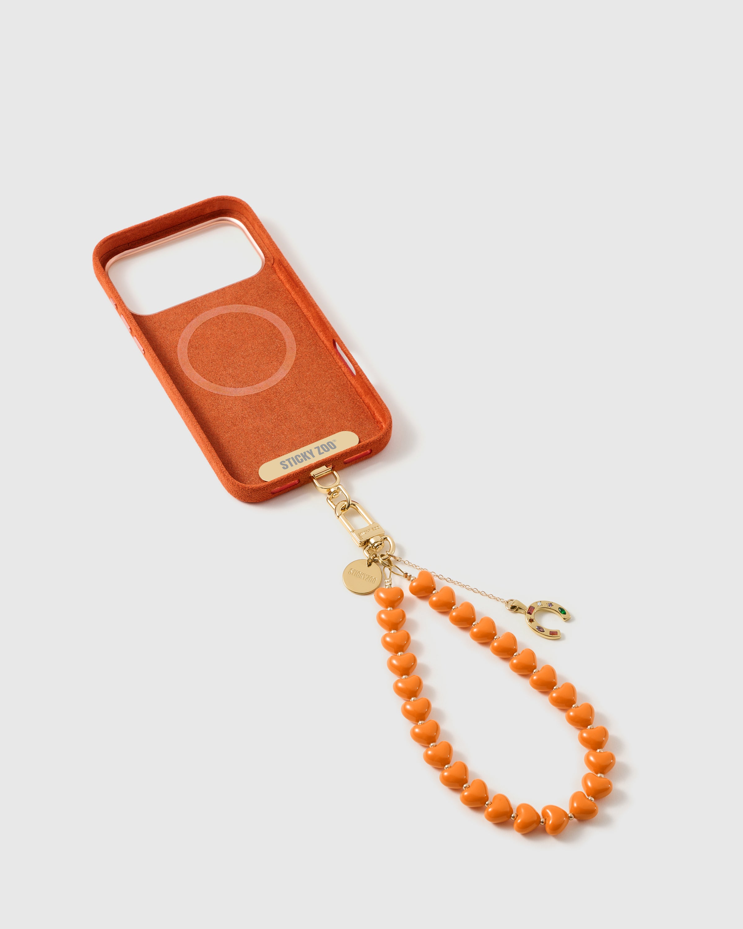 {Phone Strap Card included} STICKYZOO Phone Strap Card sitting inside phone case for universal fit