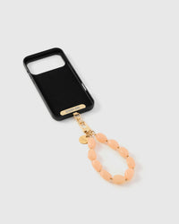 Inside of phone case showing STICKYZOO Phone Strap Card with peach stone strap connected