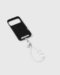 Close-up of silver-tone engraved clasp and STICKYZOO charm disc with pearl beads