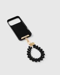 Inside of phone case showing STICKYZOO Phone Strap Card with black heart strap attached