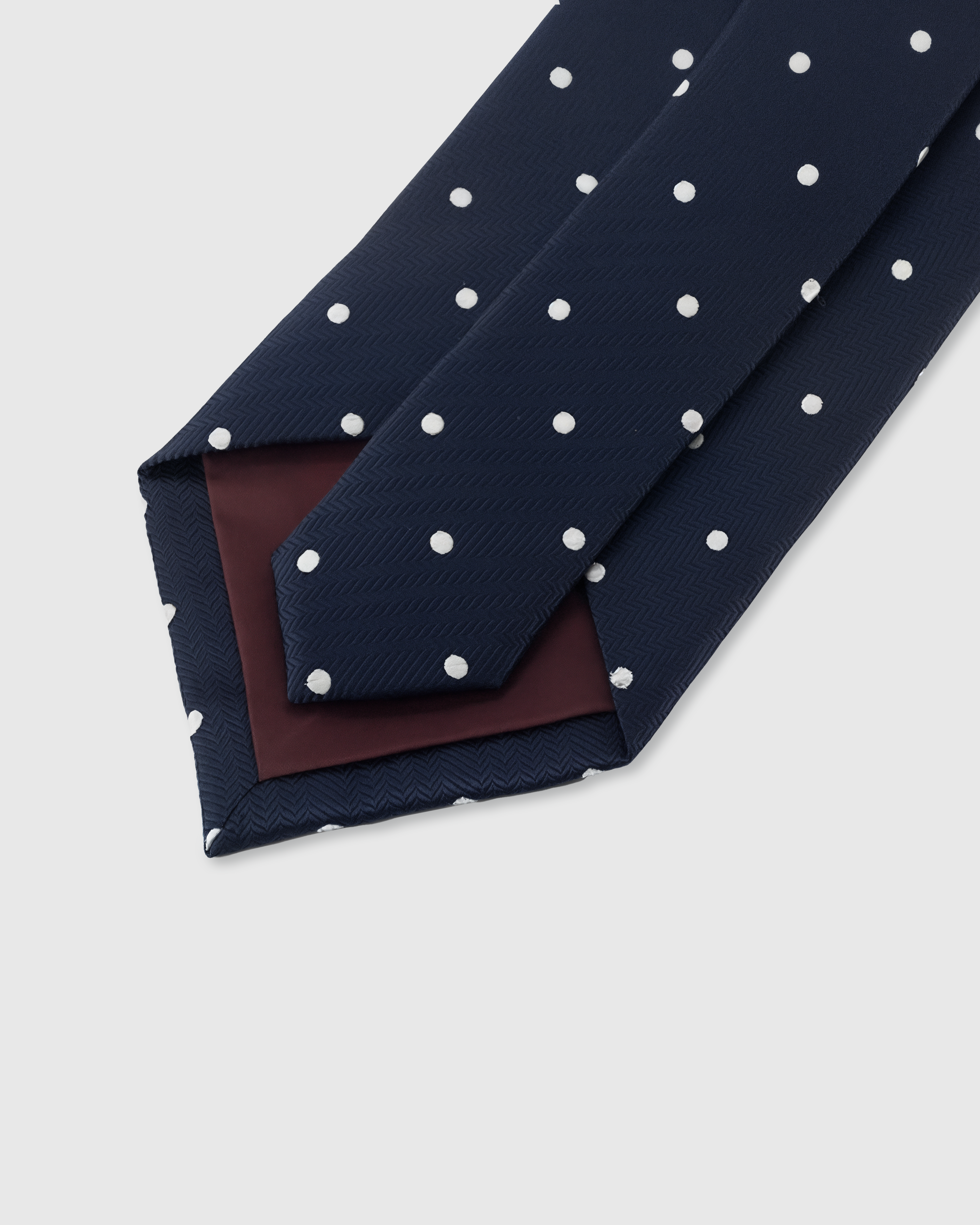 {Hand-finished interior} STICKYZOO MIDNIGHT POLKA TIE back detail showing structured interlining and hand-finished slip stitching, 145 x 8 cm
