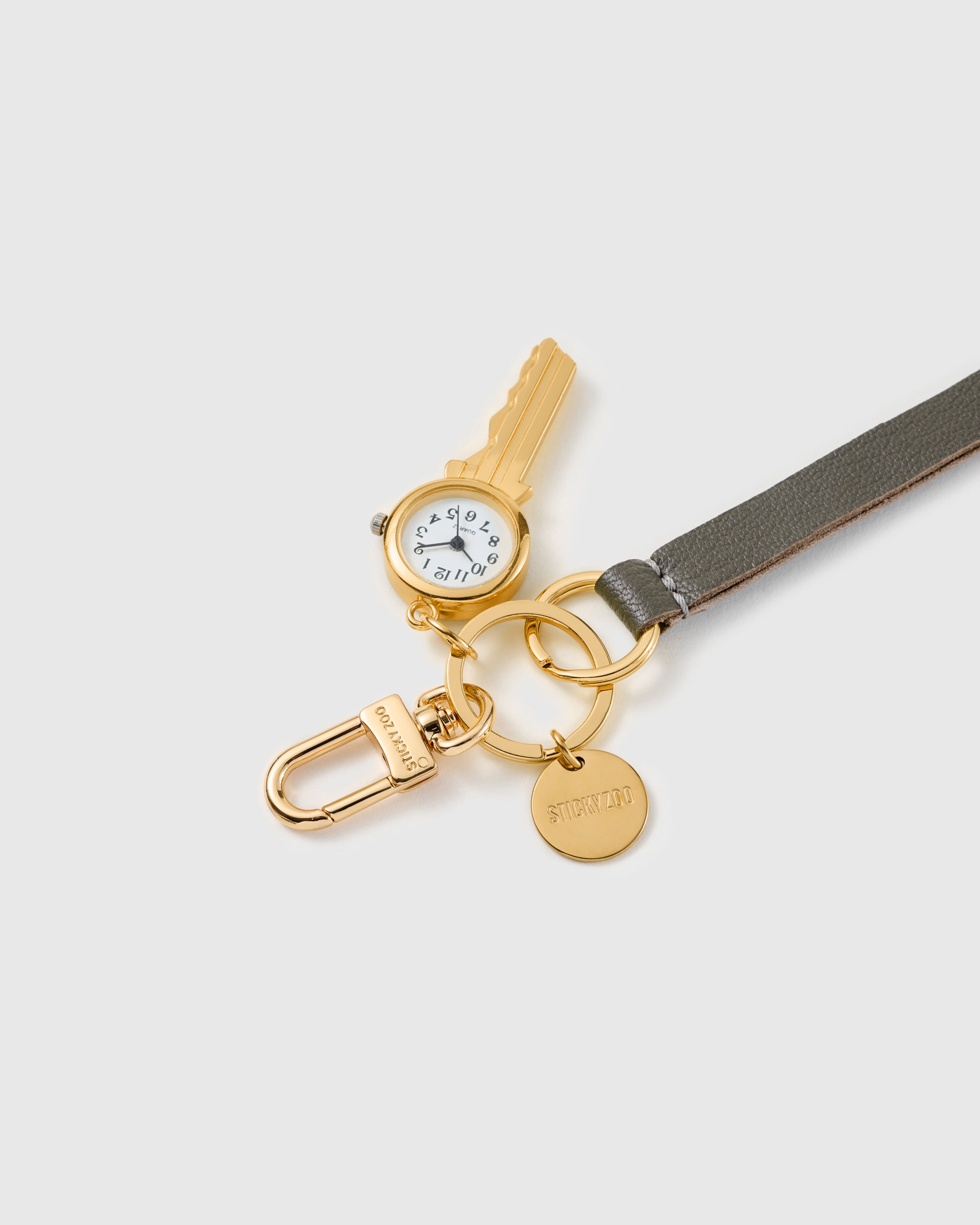 Time keeper leather phone strap clipped to a phone case showing the hands-free wrist loop in use
