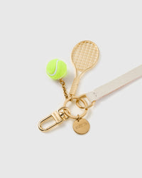 Ivory court leather phone strap clipped to a phone case showing the hands-free wrist loop in use