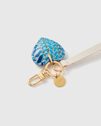 Close-up of the azure python calf-hair heart, hand whip-stitched blue edge and hand-cut leather by STICKYZOO