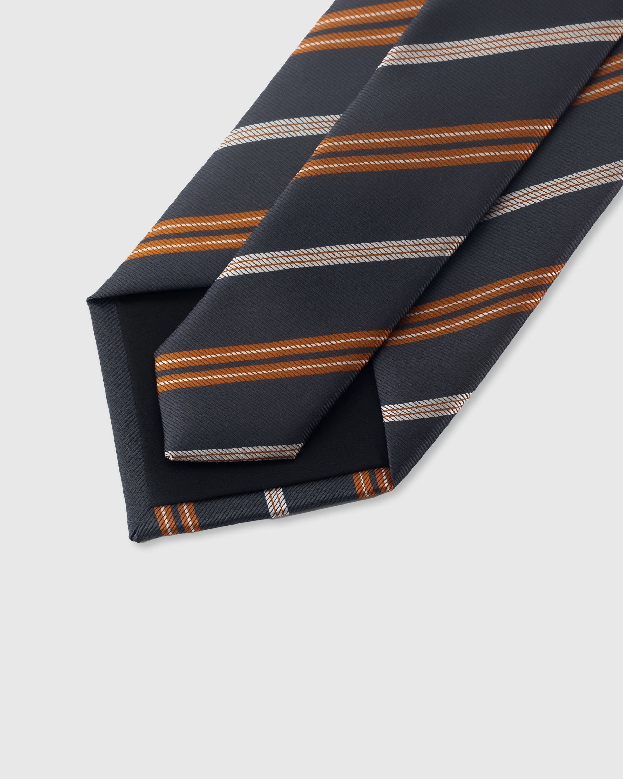 {Hand-finished interior} STICKYZOO SLATE AMBER STRIPE TIE back detail showing structured interlining and hand-finished slip stitching, 145 x 8 cm