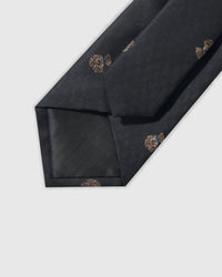 Hand-finished interior Noir Terrier Tie back view showing structured interlining and tipping on black geometric silk