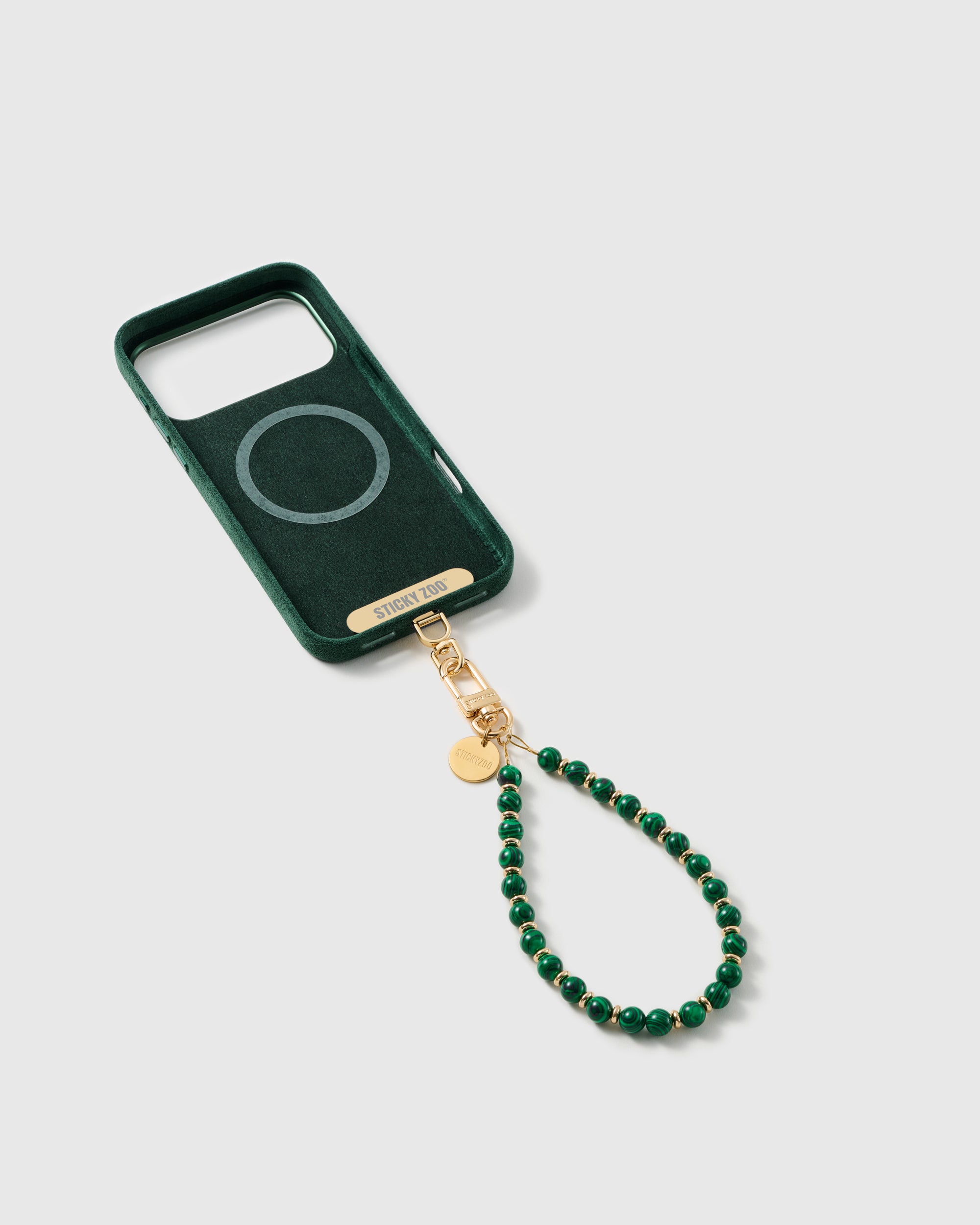 Inside of a phone case showing the STICKYZOO Phone Strap Card that enables universal compatibility