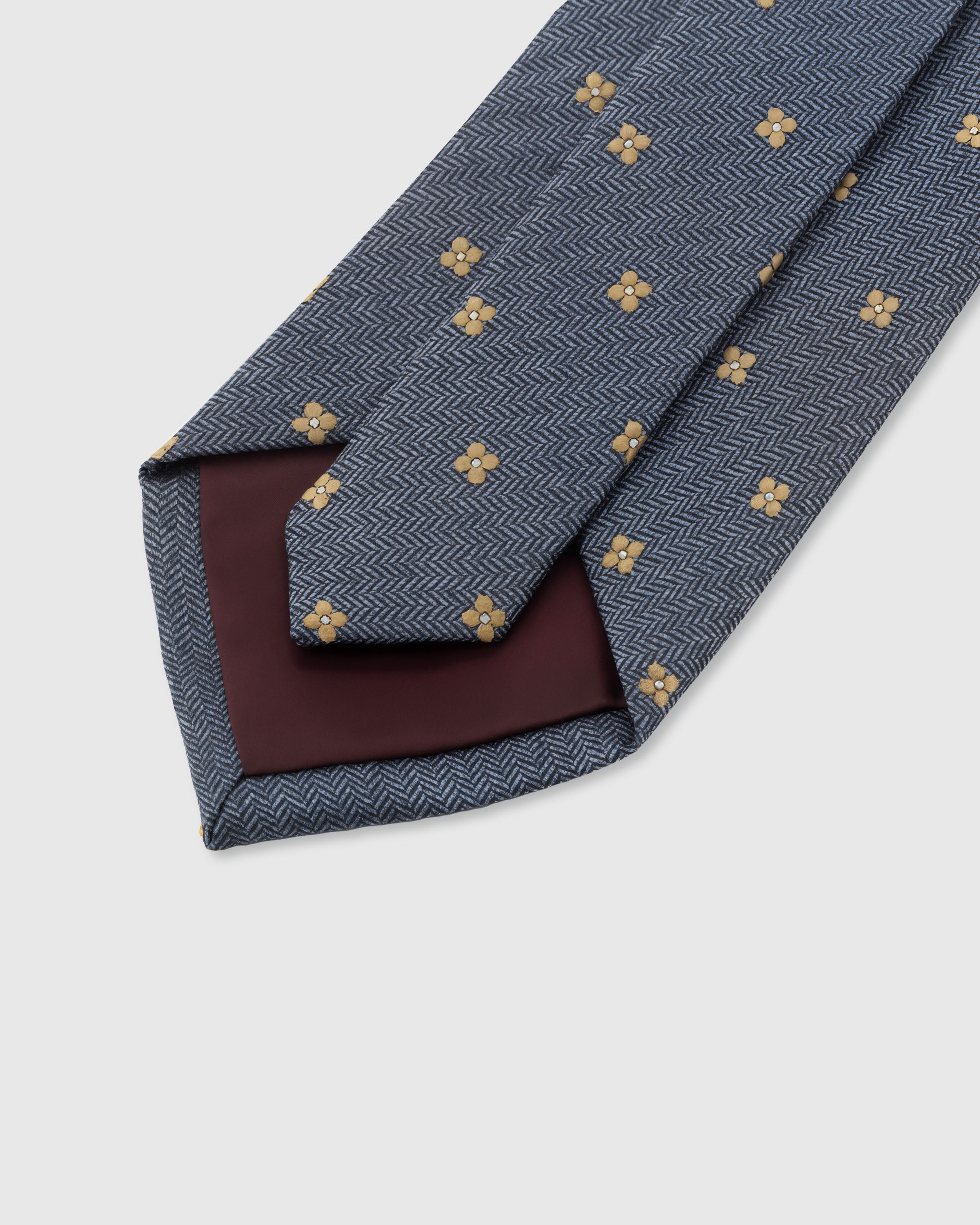 {Hand-finished interior} STICKYZOO SLATE CLOVER DOT TIE back detail showing structured interlining and hand-finished slip stitching, 145 x 8 cm