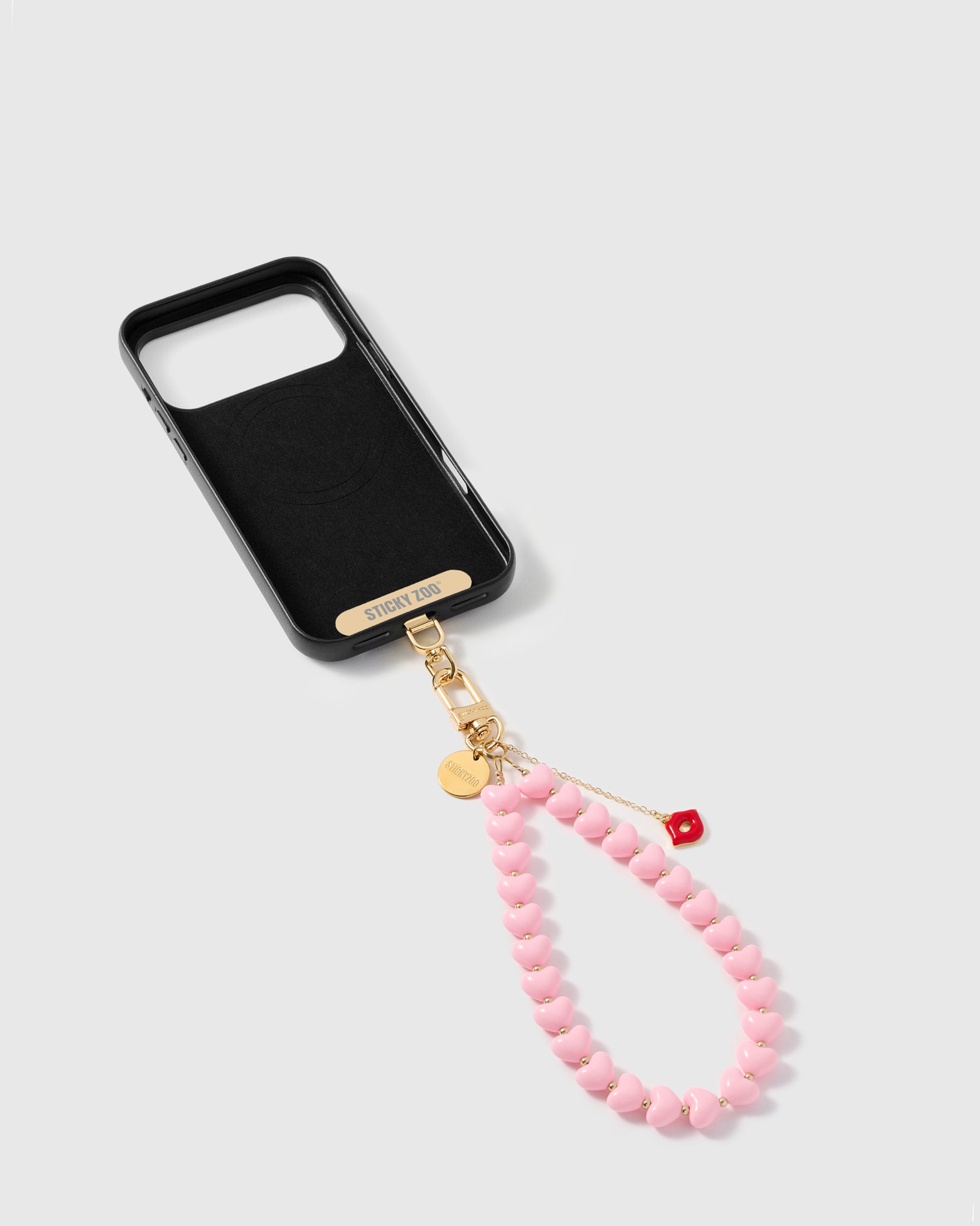 STICKYZOO Phone Strap Card universal adapter shown alongside pink heart strap