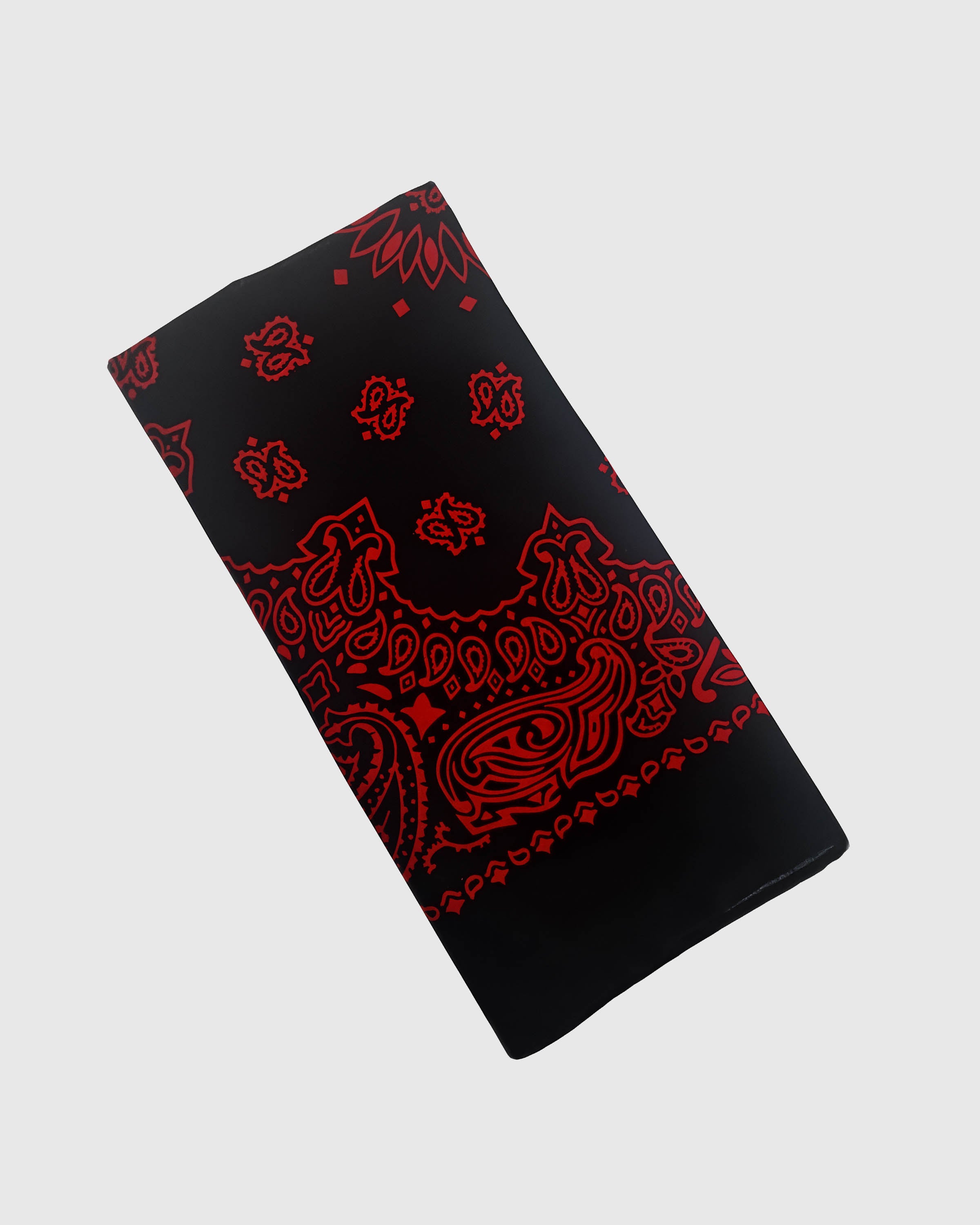 STICKYZOO midnight bandana silk scarf folded to show the soft silk drape and crimson paisley border
```
