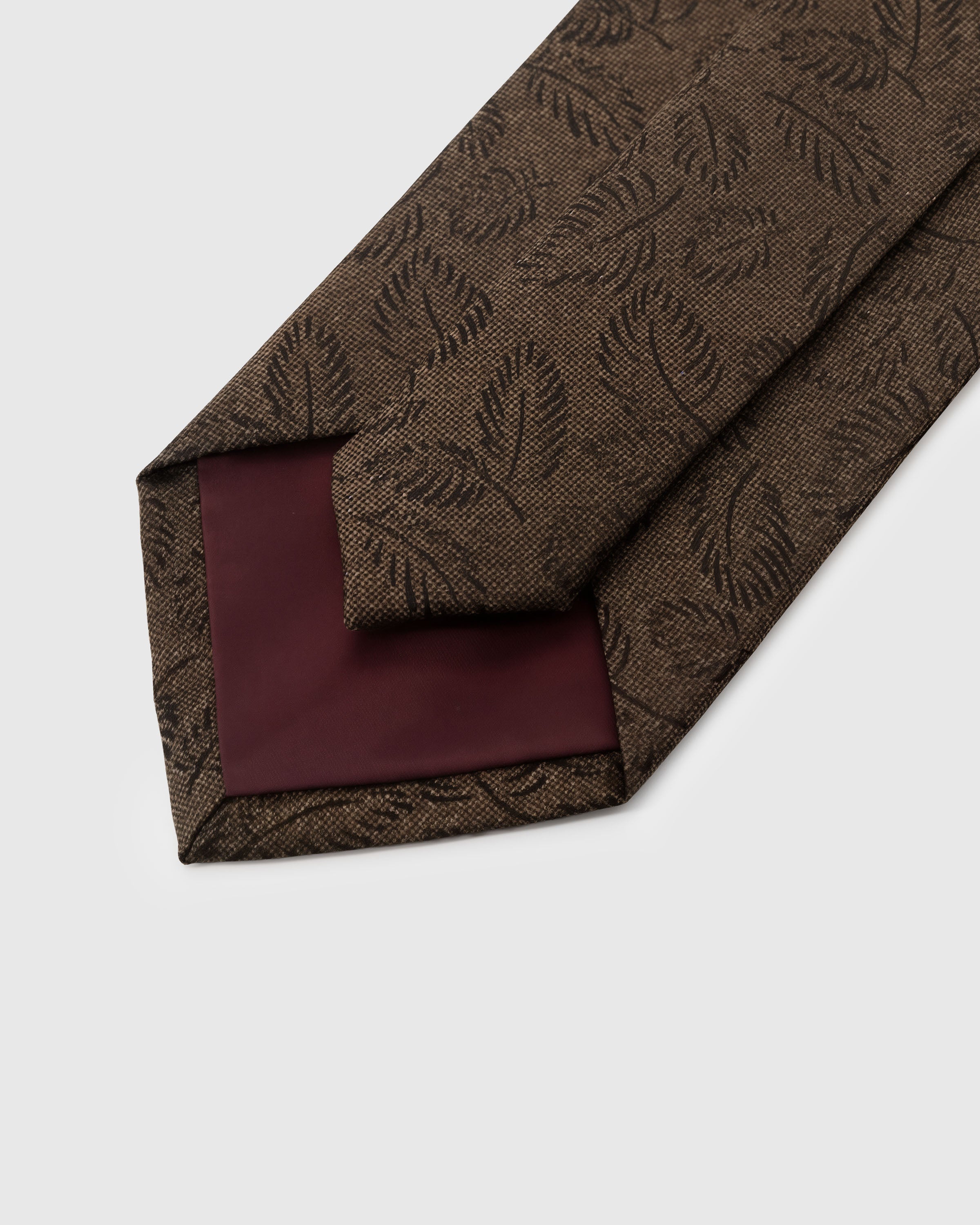 STICKYZOO Umber Leaf Tie back detail showing structured interlining and hand-finished slip stitching, 145 x 8 cm
