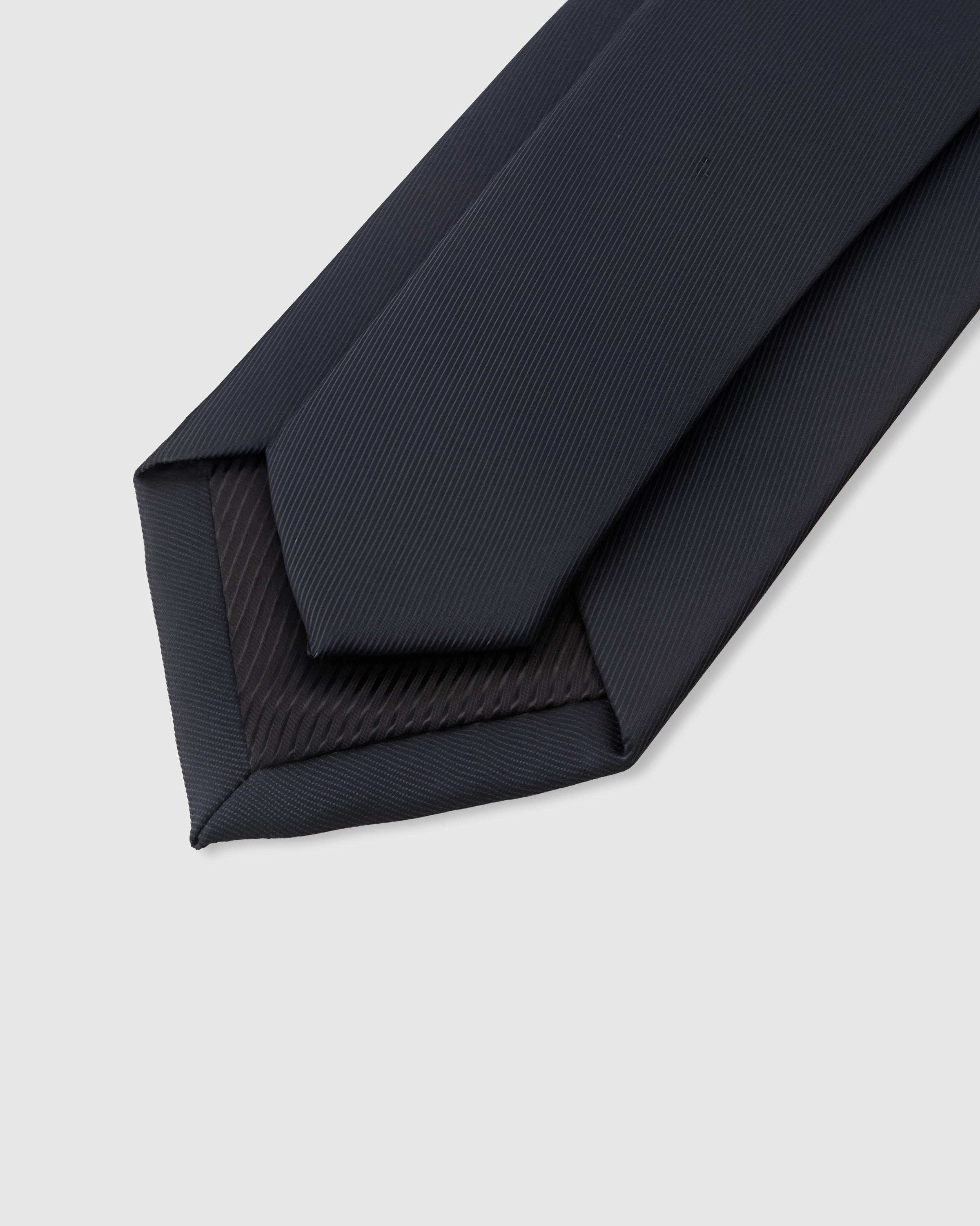 STICKYZOO Midnight Solid Tie showing structured interlining and dimensional knot, 145 x 8 cm